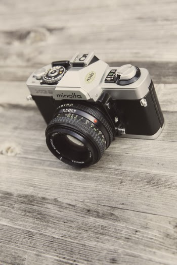 Minolta Camera on Wooden Surface