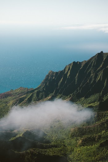 Minutes after I took this photo, the clouds rolled in. The valley had disappeared, leaving nothing but the highest peaks visible through a thick layer of gray. 