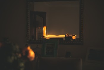 Mirror Hanging in Front of White Wall