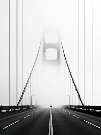 Misty Suspension Bridge in Black and White