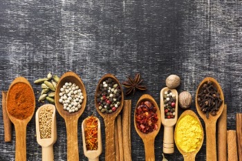 Mix of colorful spicy powder on table Free Photo
