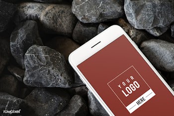 Mobile phone on a rocky surface | Free stock psd mockup - 527614