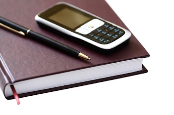 Mobile telephone, note pad and pen
