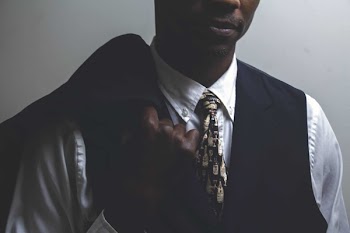          Model Holding Suit Jacket Free Photo     