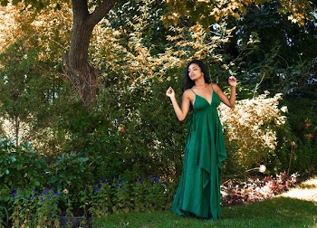 Model Poses In Long Green Maxi Dress