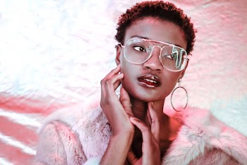 Model Poses With Neon Reflection
