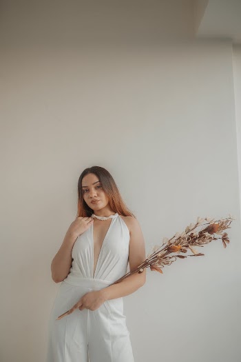 Model Posing in Elegant White Outfit