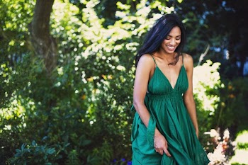Model Smiles And Walks In Green Dress