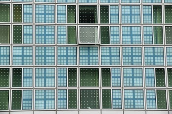 Modern Building Hilton Hotel Munich with one open window

