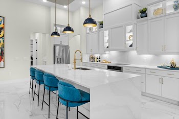 Modern Kitchen with Elegant Marble Island and Blue Bar Stools