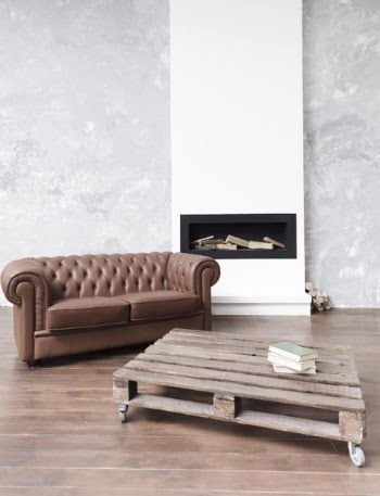 Modern minimalist living room with leather sofa and fireplace Free Photo