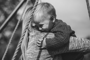 Mom and son hugging