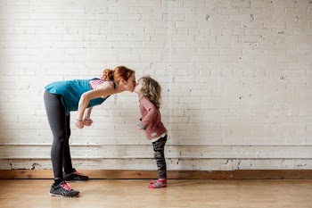 Mom Gives Kiss To Her Child