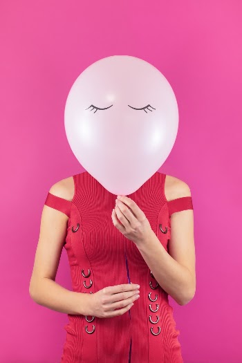 "Monday Mood" - Woman with a balloon instead of her face.