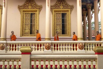 Monks Standing on Porch