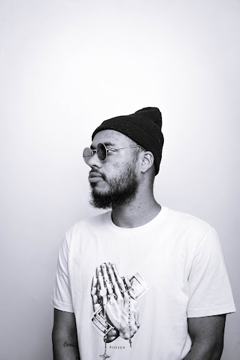 Monochorme Photo Of Man Wearing Bonnet