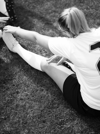 Monochrome Photo of a Woman Stretching