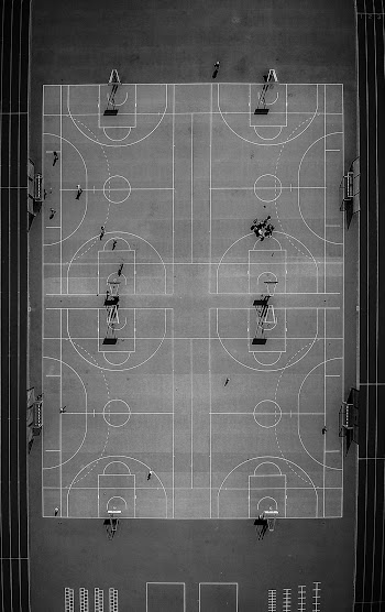 Monochrome Photo of Basketball Court
