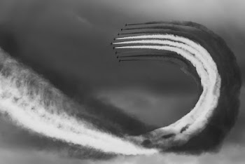 Monochrome Photo of Jet Flying Through the Air