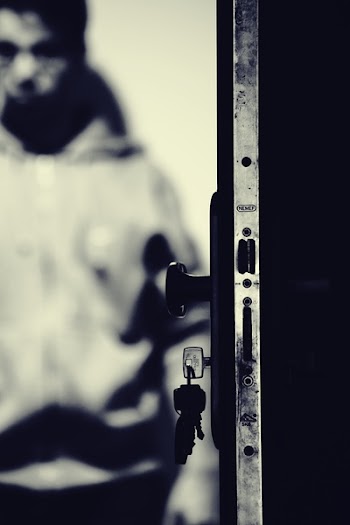 Monochrome Photo of Keys and Door Knob