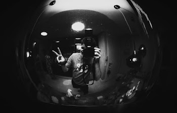 Monochrome Photo of Man Capturing His Reflection