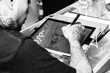 Monochrome Photo of Man Drawing Nefertiti