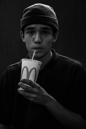 Monochrome Photo of Man Drinking