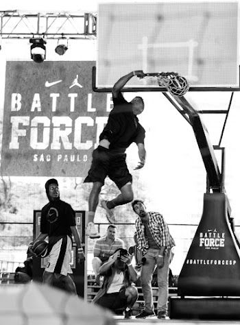 Monochrome Photo of Man Dunking on Basketball Ring
