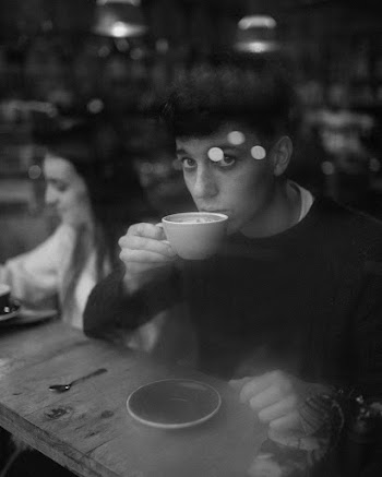 Monochrome Photo of Man Holding Teacup