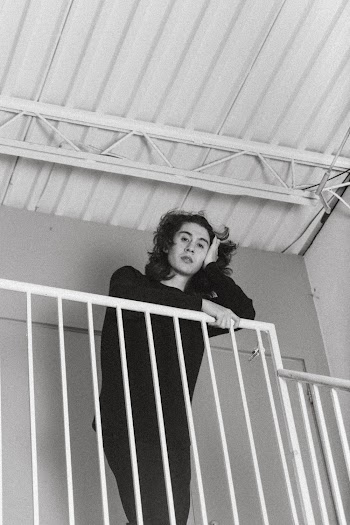 Monochrome Photo Of Man Leaning On Handrail