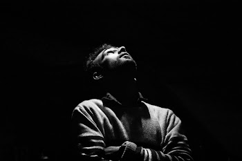 Monochrome Photo of Man Looking Up