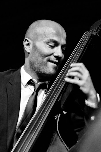 Monochrome Photo of Man Playing Cello