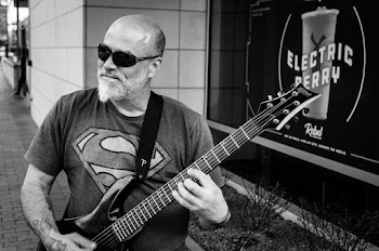 Monochrome Photo of Man Playing Electric Guitar