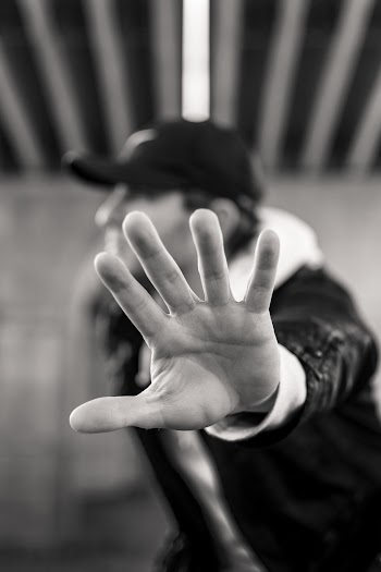 Monochrome Photo of Man Showing His Left Hand