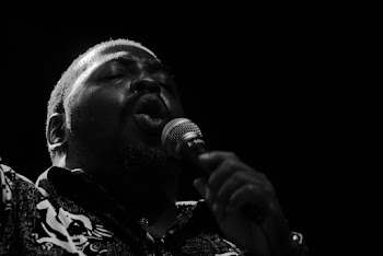 Monochrome Photo of Man Singing