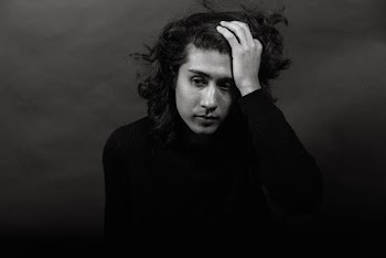 Monochrome Photo Of Man Touching His Hair