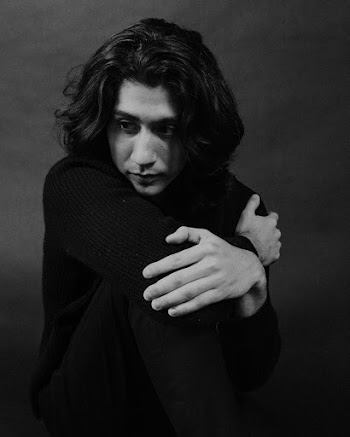 Monochrome Photo Of Man Touching His Knee