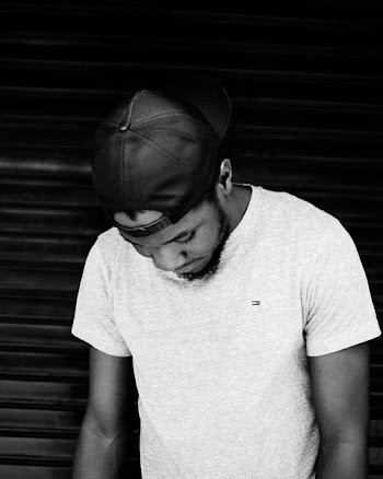 Monochrome Photo of Man Wearing Cap