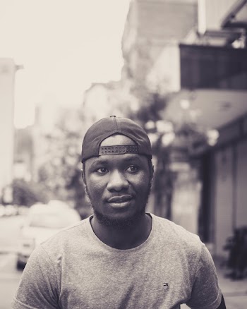 Monochrome Photo of Man Wearing Cap