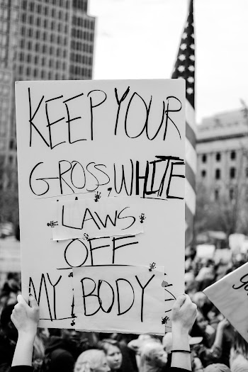 Monochrome Photo Of People Holding Banners