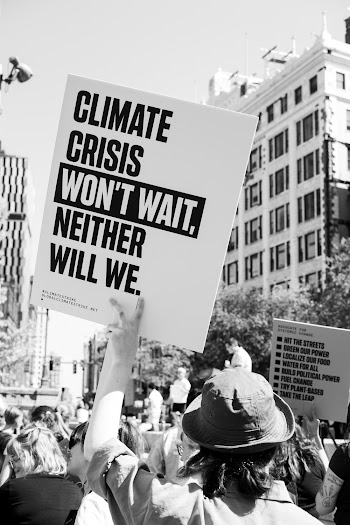 Monochrome Photo Of People Holding Banners