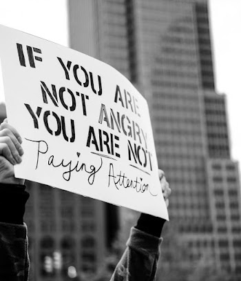 Monochrome Photo Of People Holding Banners