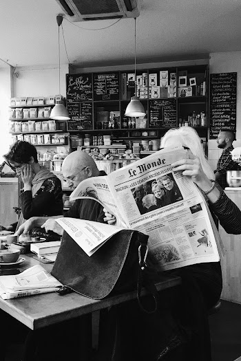Monochrome Photo Of Person Holding Newspaper