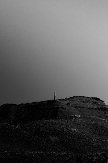 Monochrome Photo Of Person Standing On Desert