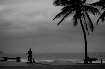 Monochrome Photo of Person Standing on Seashore