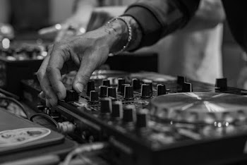 Monochrome Photo of Person Using Mixing Panel