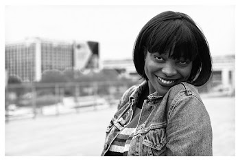 Monochrome Photo of Smiling Woman on Street