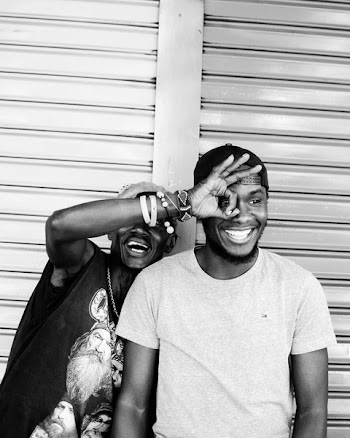 Monochrome Photo of Two Men Smiling