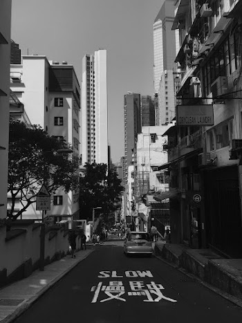 Monochrome Photo of Vehicle on Road