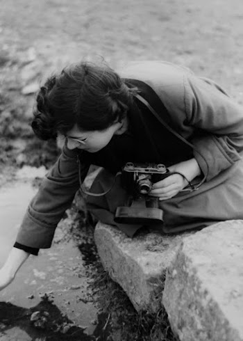 Monochrome Photo Of Woman Holding Camera
